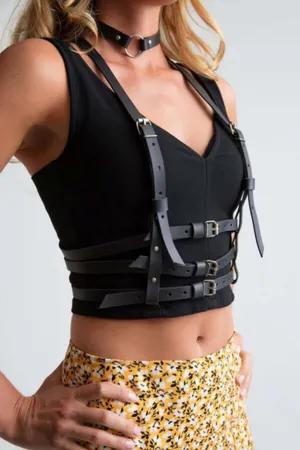 Black faux leather strappy body harness with choker on model