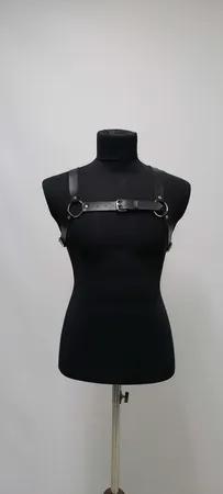 Black faux leather strappy chest harness with O-ring and buckle