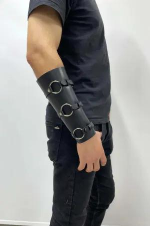 Black faux leather triple O-ring arm cuff with adjustable buckles