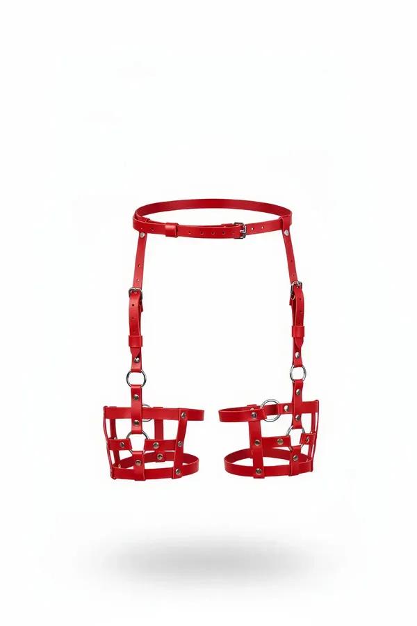 red faux leather caged leg garter harness with silver O-rings and riveted studs on structured thigh panels
