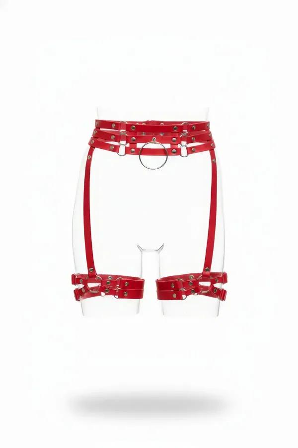 red faux leather triple-strap garter harness with silver O-ring and rivet-detail thigh cuffs on mannequin