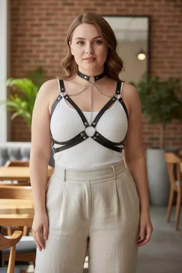 black faux leather caged chest harness with silver choker and detachable body chain worn over white tank top