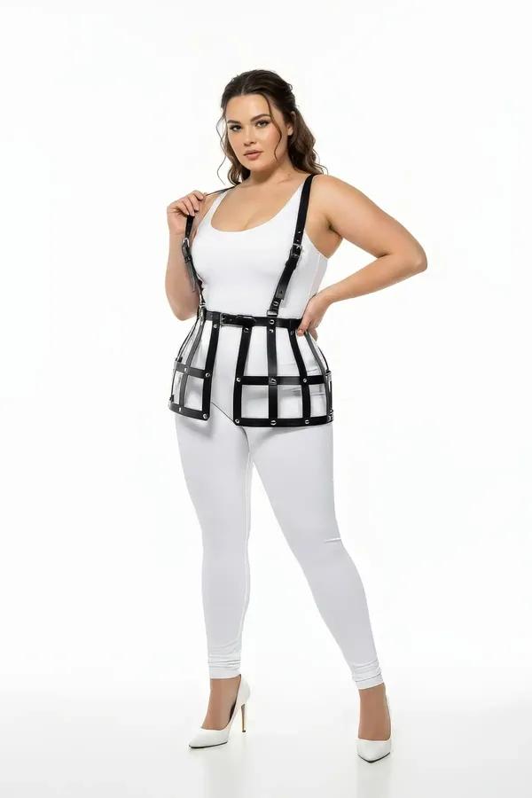 black faux leather caged waist harness with over-the-shoulder suspender straps and matte black O-ring hardware, worn over whi
