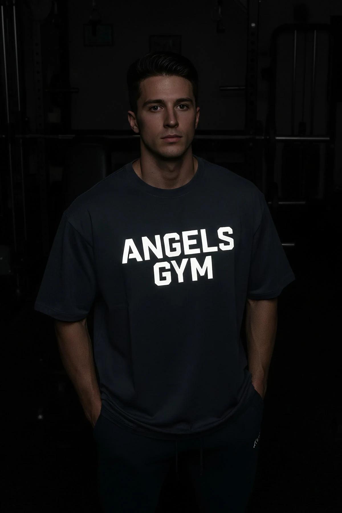 black cotton oversized tee front view bold white screen print logo gym streetwear
