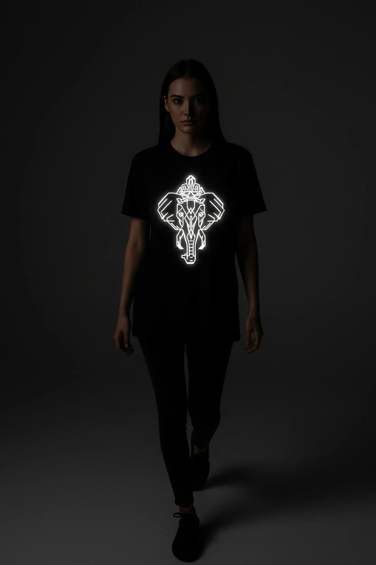 black graphic t-shirt relaxed silhouette worn with hands in pockets gym background
