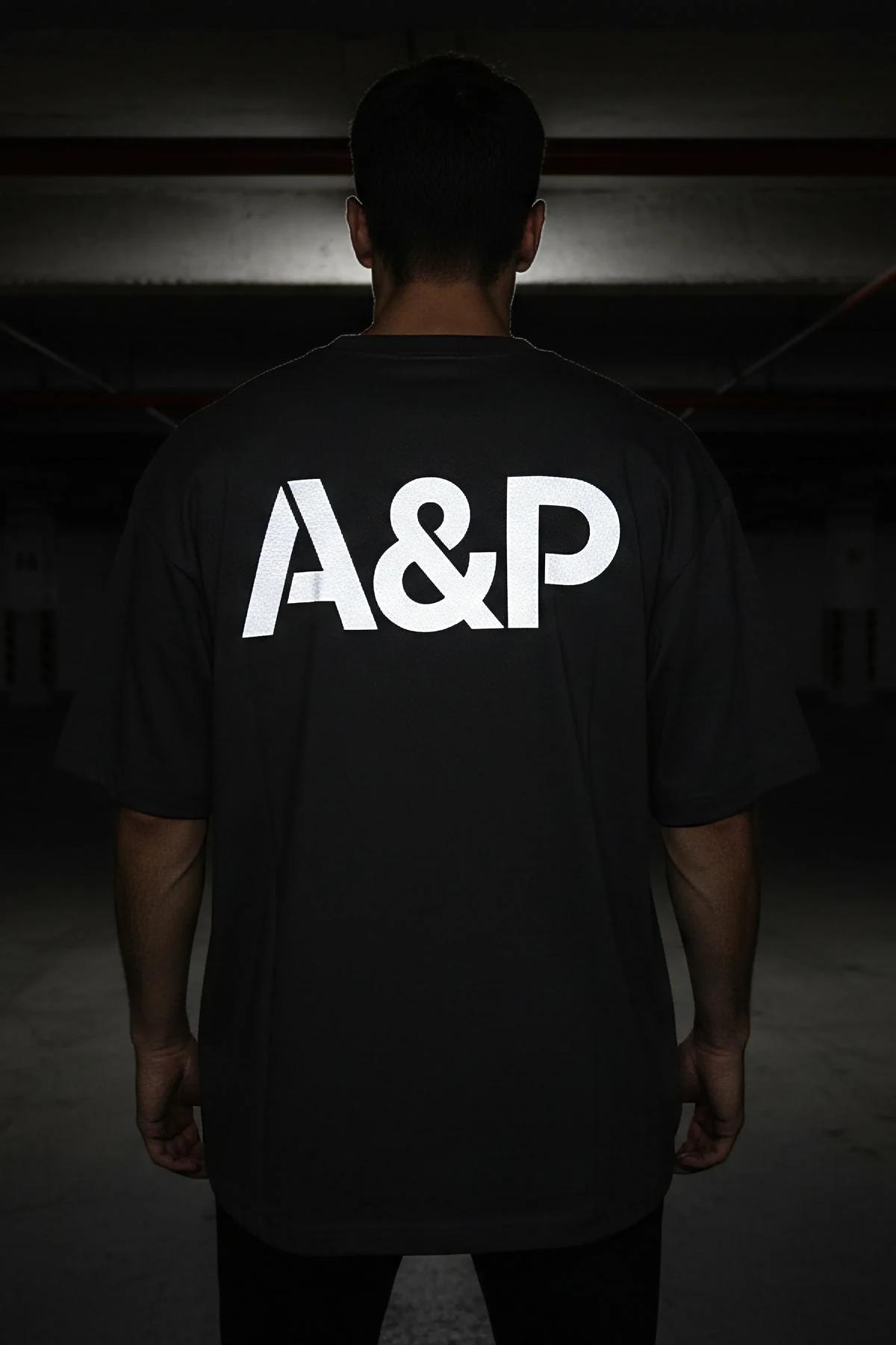 custom printed black oversize cotton tee with large reflective A&P back logo drop-shoulder streetwear silhouette