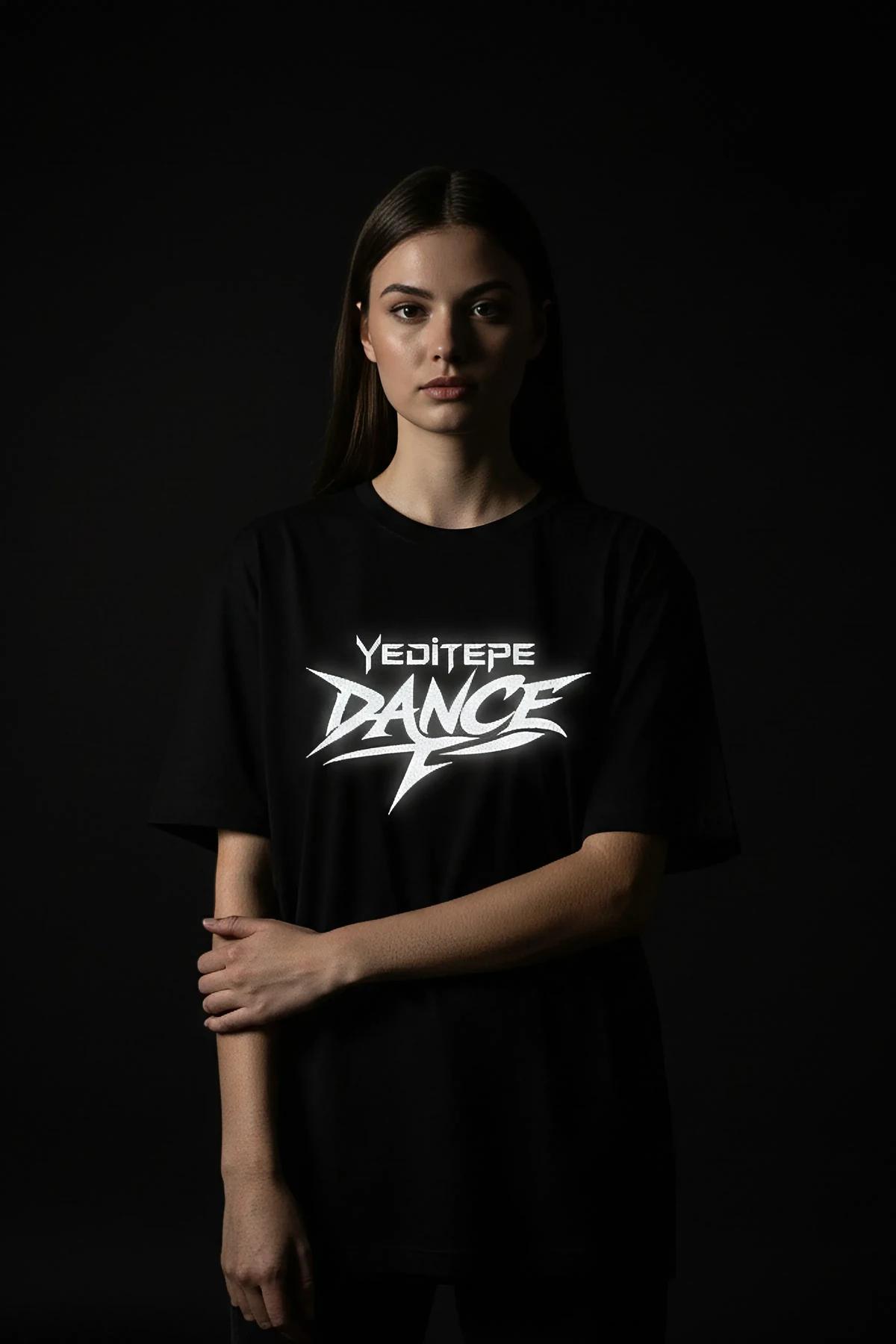 black oversized graphic t-shirt with white reflective Kültür Dance angular print on chest