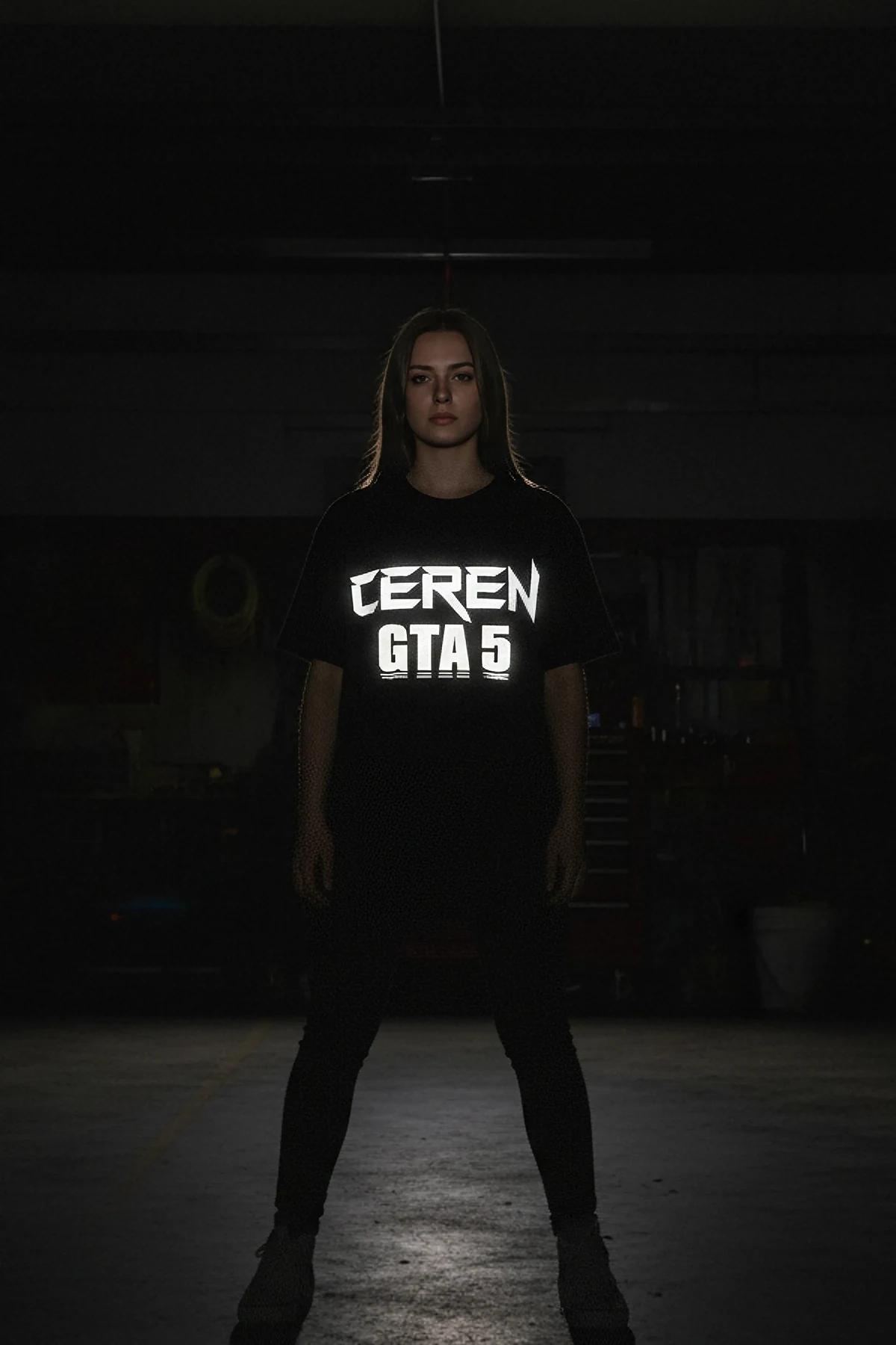 close-up of photoluminescent Ceren GTA 5 chest print glowing white on black oversized tee