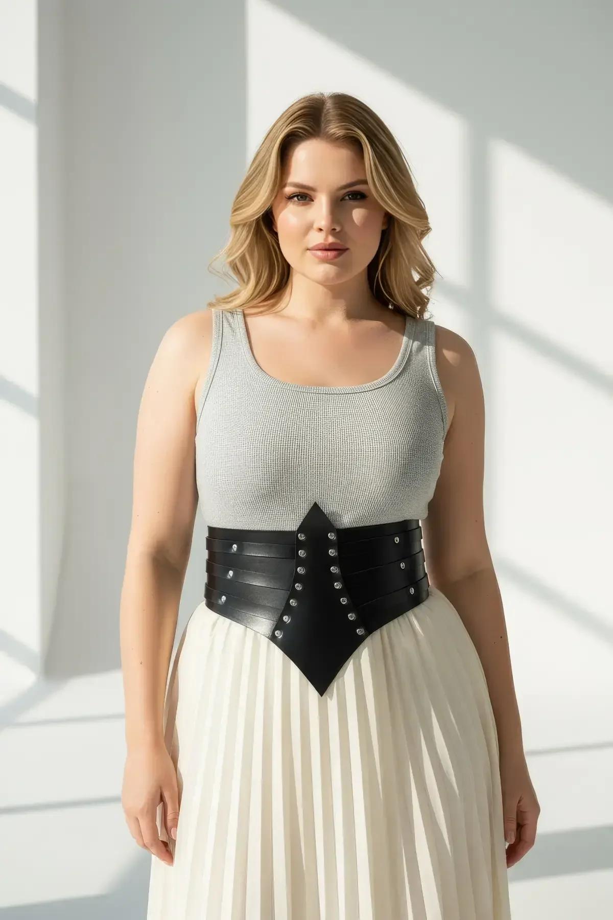 Side profile of black faux leather bodice belt showing 15 cm panel height and stud row detail