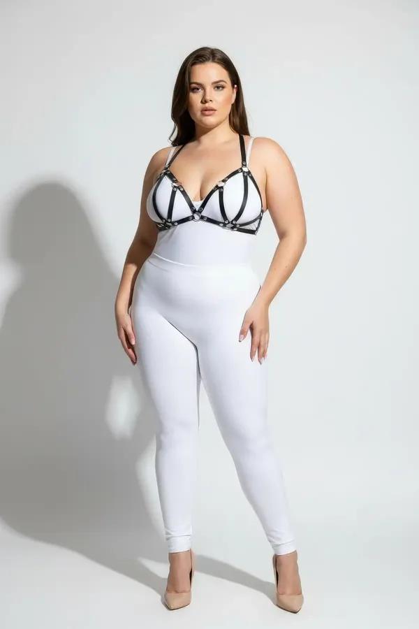 black faux leather strappy chest harness with silver O-ring hardware cage bra design on plus-size model