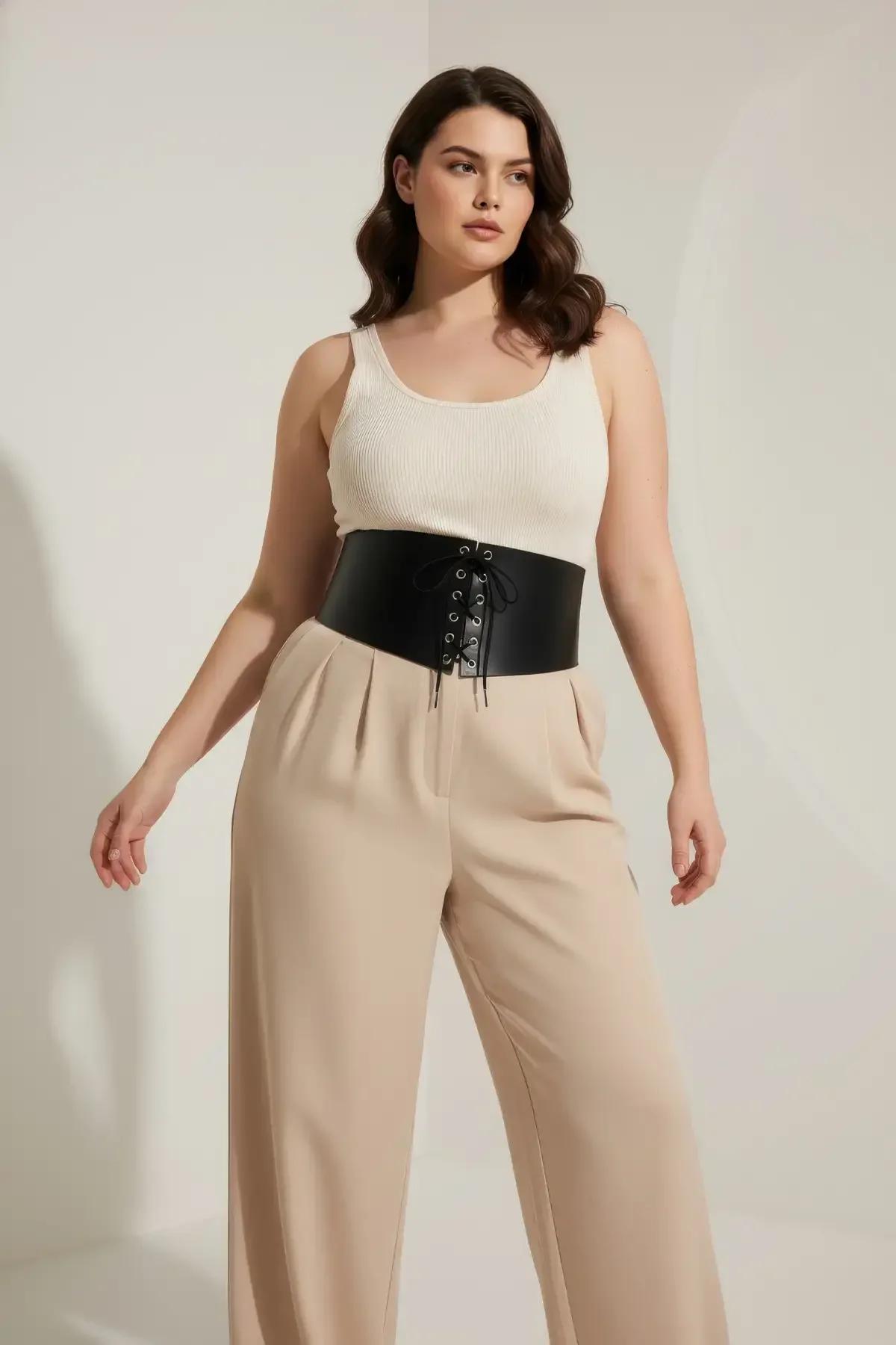 wide black vegan leather waist cincher front lace-up detail close-up showing silver eyelets
