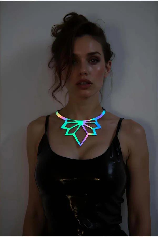 Iridescent geometric laser cut choker with teal-violet-gold color shift worn against black latex top