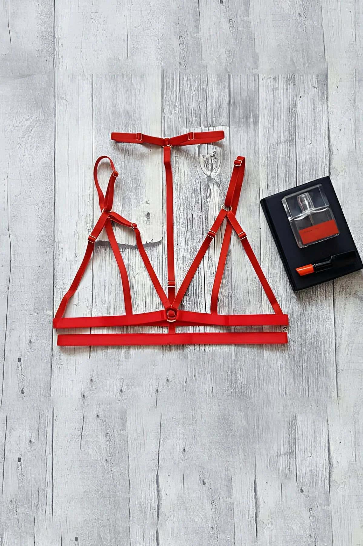 adjustable red elastic bra harness gold buckle detail close-up