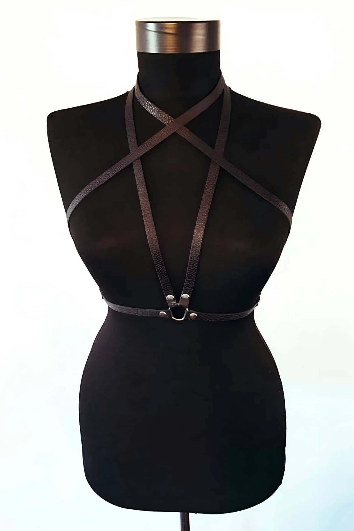 black vegan leather body harness cross X strap detail closeup silver hardware