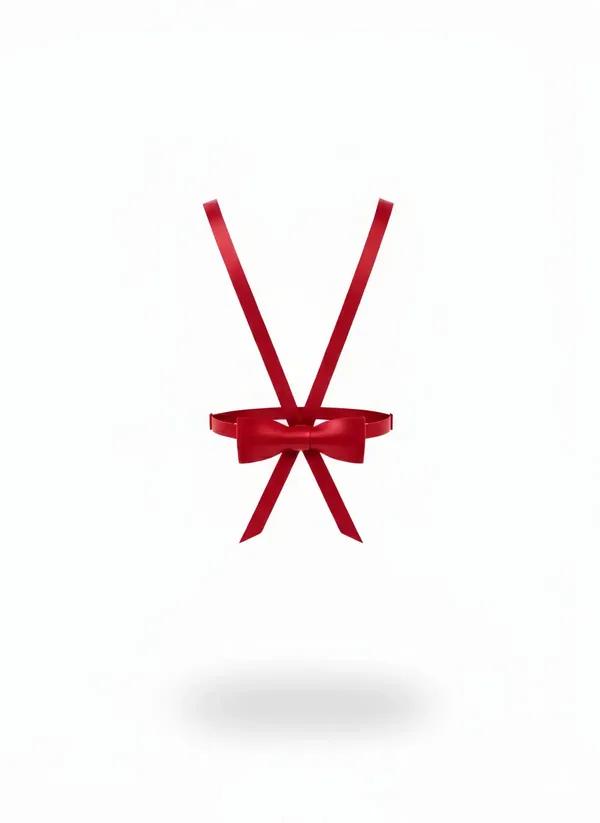 Red satin ribbon harness with structured bow at waist and crossed shoulder straps on white background