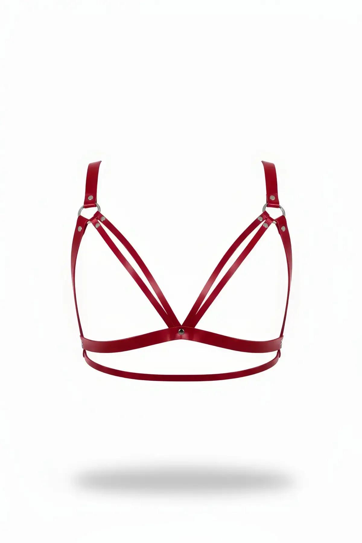 Red faux leather strappy chest harness bra with double parallel triangle cups and silver O-rings on white background