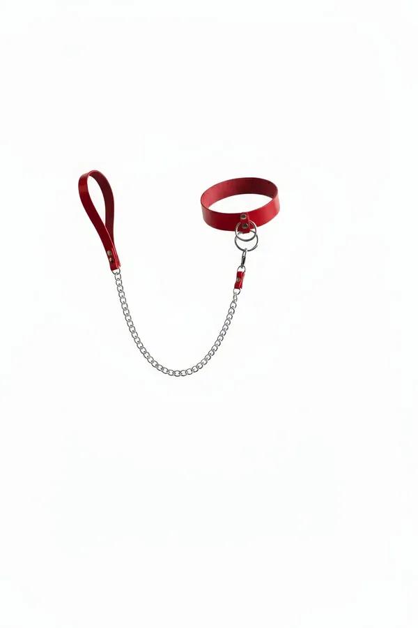 red faux leather choker with silver O-ring and detachable silver link chain leash and loop handle on white background