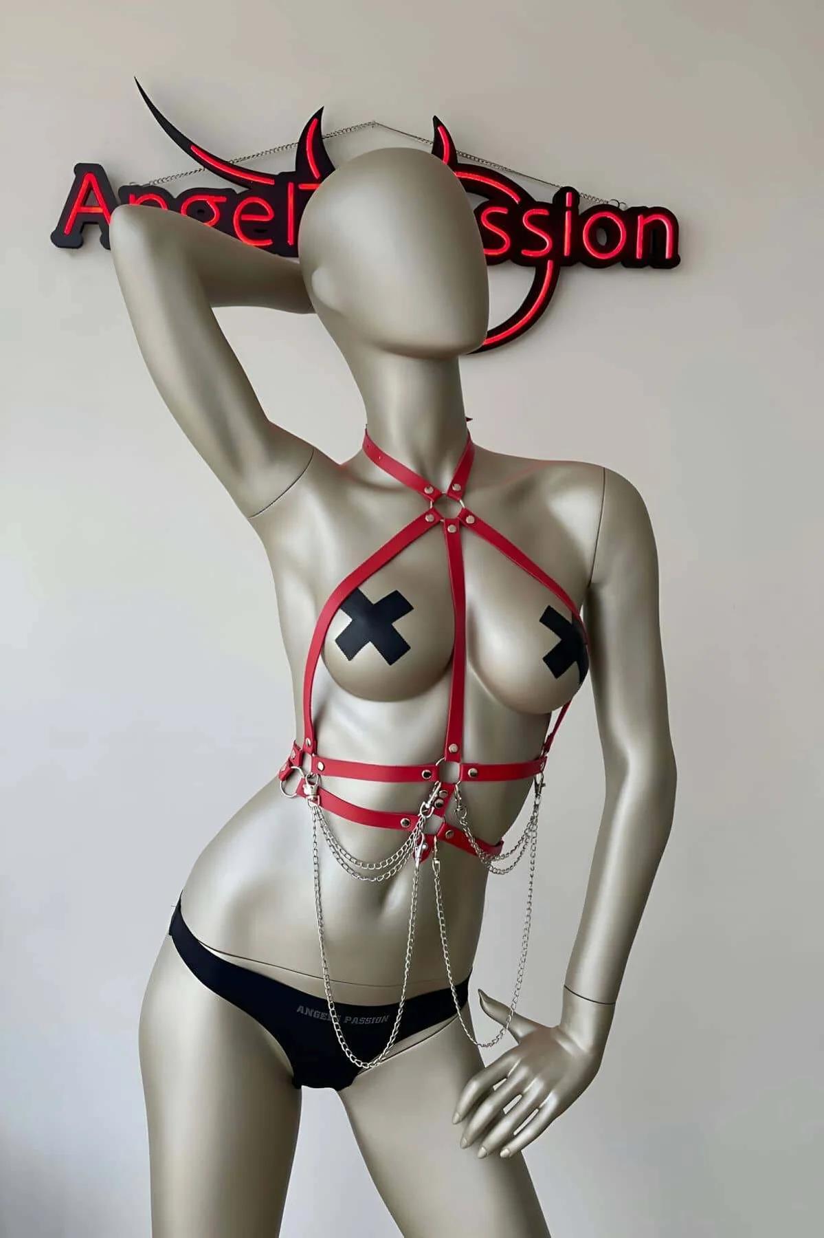 Red PU strap chest harness showing four horizontal bands and silver O-ring connectors at ribcage