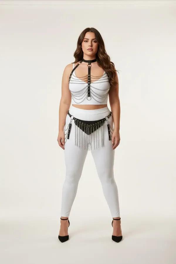 black faux leather chain harness set with multi-strand silver chains and fringe waist belt worn over white crop top