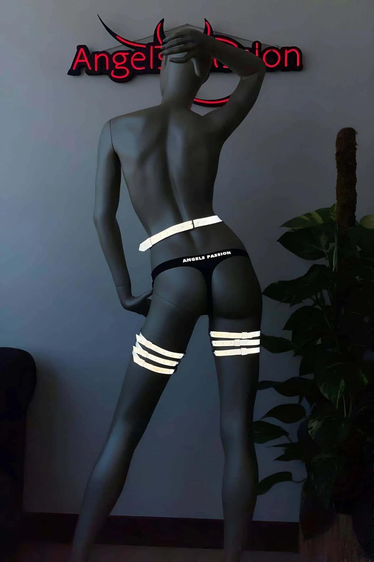 Side angle of reflective leg harness garter showing stacked thigh strap spacing on mannequin