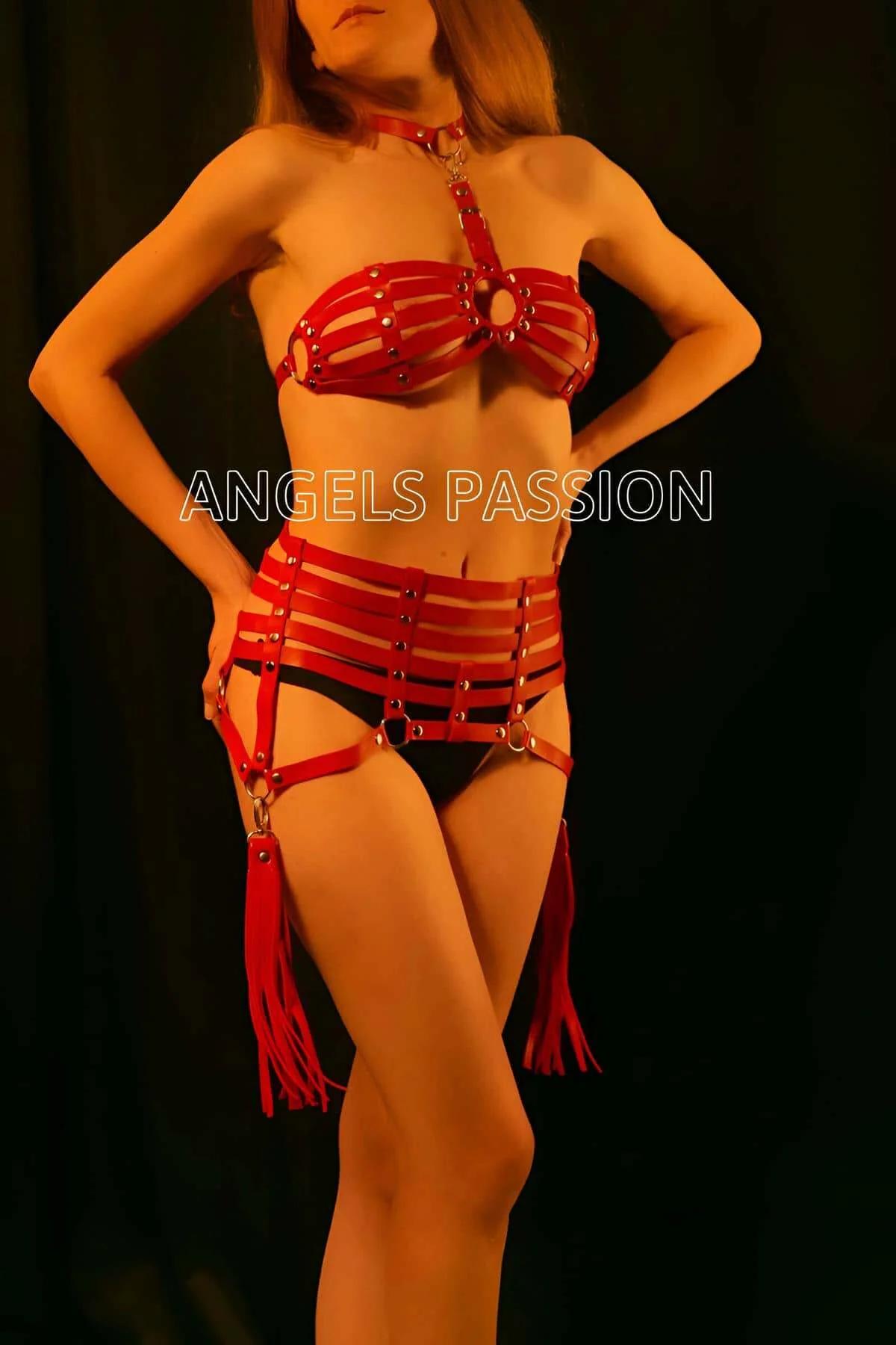 adjustable red faux leather waist band harness section with four horizontal straps and buckle closures