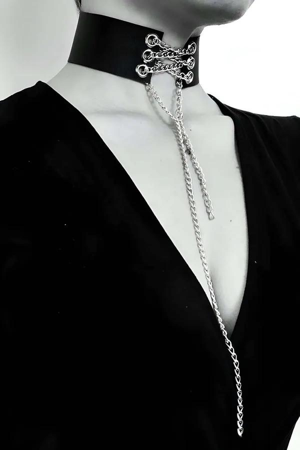 Black faux leather wide-band choker necklace with silver O-rings and multi-length draped chains on male mannequin