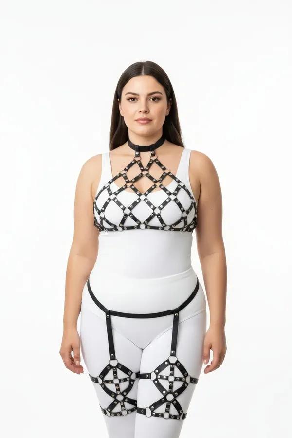 Black faux leather caged full body harness set with diamond chest cage, choker, and caged thigh garters worn over white base 