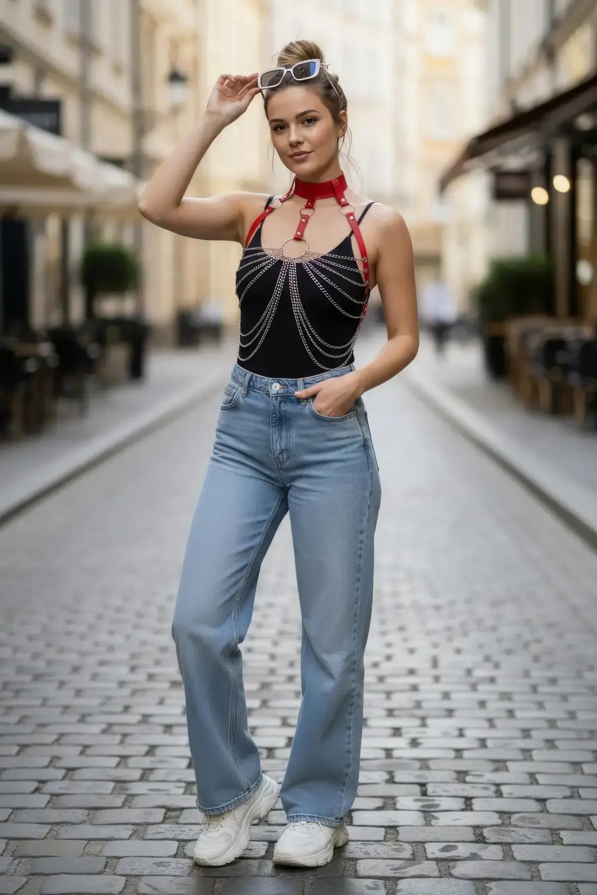 adjustable red faux leather harness with silver-tone chain drape, side angle view