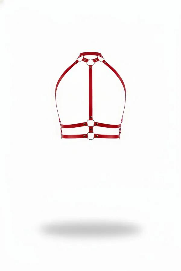 Red faux leather halter harness with chrome O-rings and double parallel underbust straps on white background