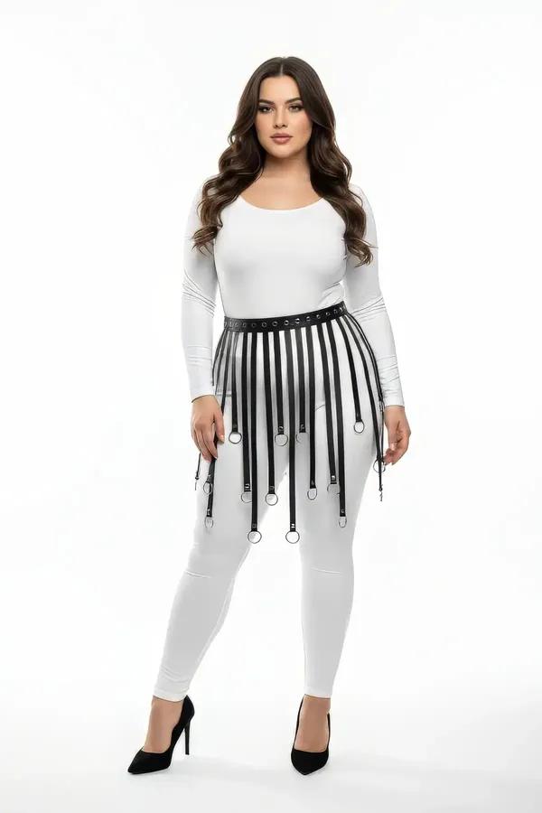 black faux leather skirt harness with cascading vertical straps and silver O-rings worn over white leggings