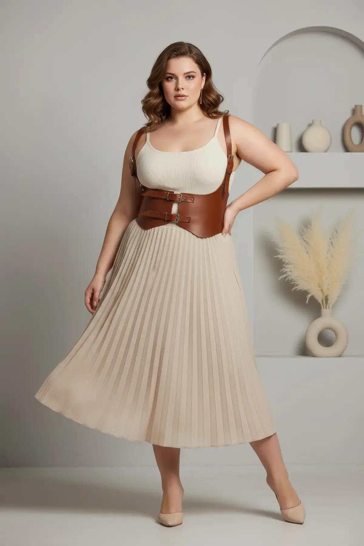 cognac tan underbust harness belt front view showing dual gold-tone buckle closures and structured wide panel