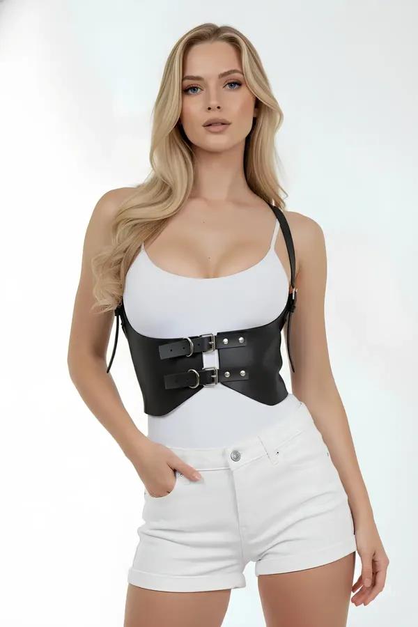black faux leather underbust waist cincher harness with dual silver buckles worn over white tank top