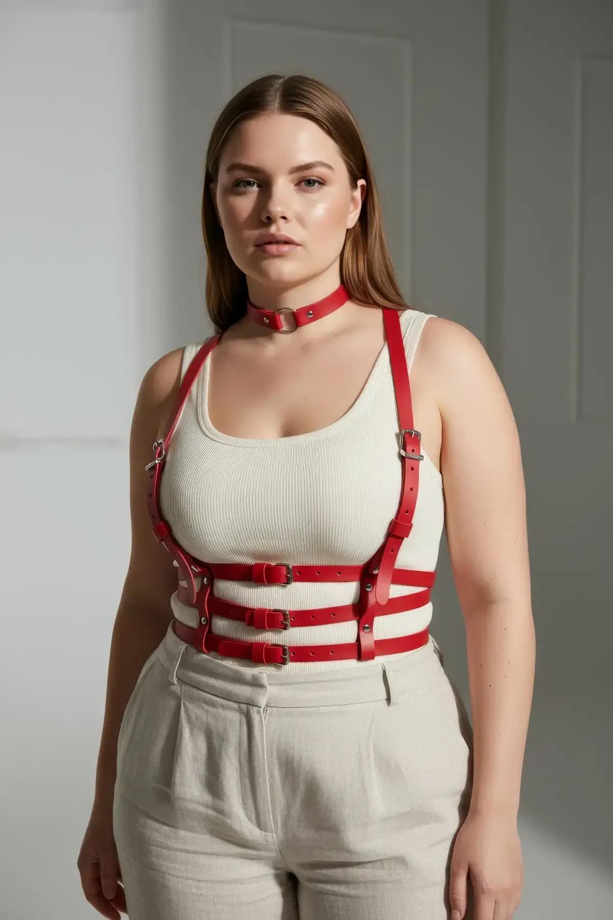 side angle of red underbust harness on plus-size model showing structured cage silhouette below bust