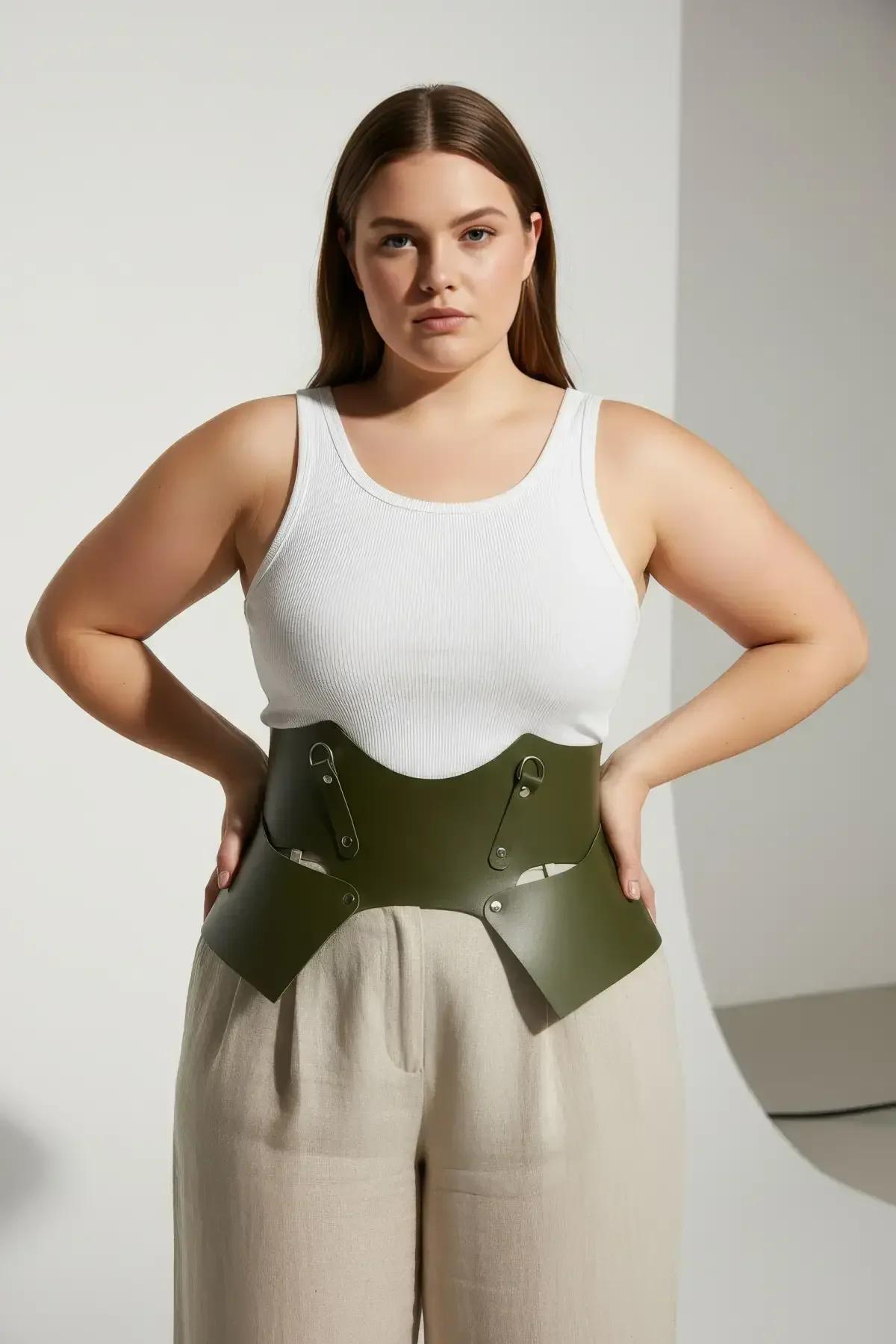olive green wide harness belt laid flat showing cut-out panel shape and inner fabric lining