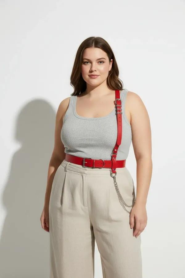 Red faux leather harness belt with single right shoulder strap, silver O-ring buckle, and detachable silver chain at waist