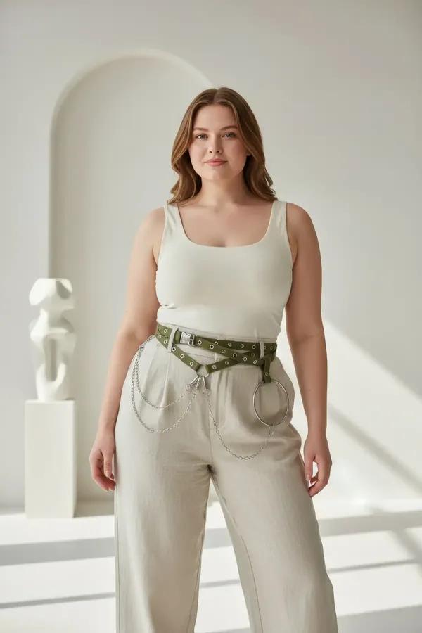 olive green faux leather belt harness with dual grommet rows silver draped chains and center O-ring worn at waist