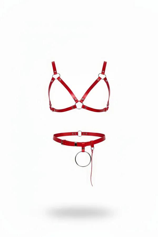 Red vegan leather strappy harness bra and O-ring waist belt set with silver-tone hardware on white background