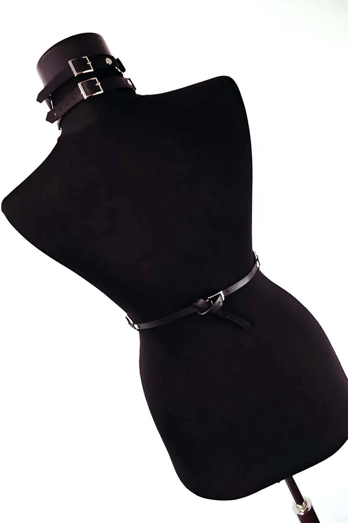 Side view of adjustable waist belt and layered silver chains on black chest harness