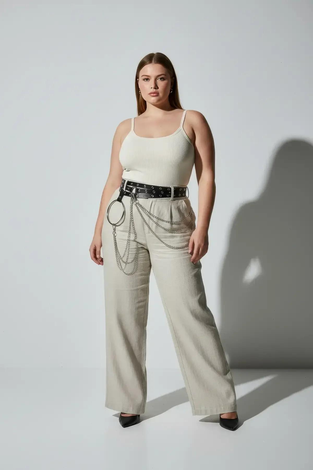 Side view of black grommet harness belt showing layered silver chain drape length