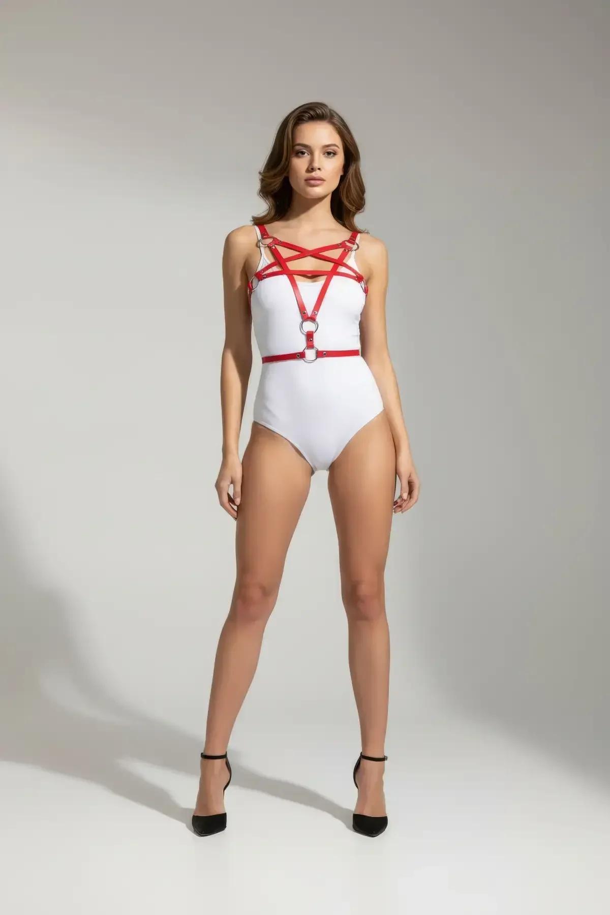close-up of red faux leather cross-strap chest harness showing four diagonal straps and central silver O-ring