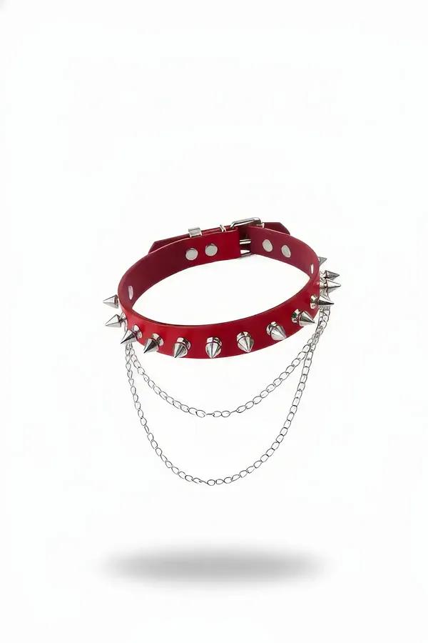 Red faux leather spiked choker with single row of silver cone spikes and three draped silver link chains, adjustable buckle c