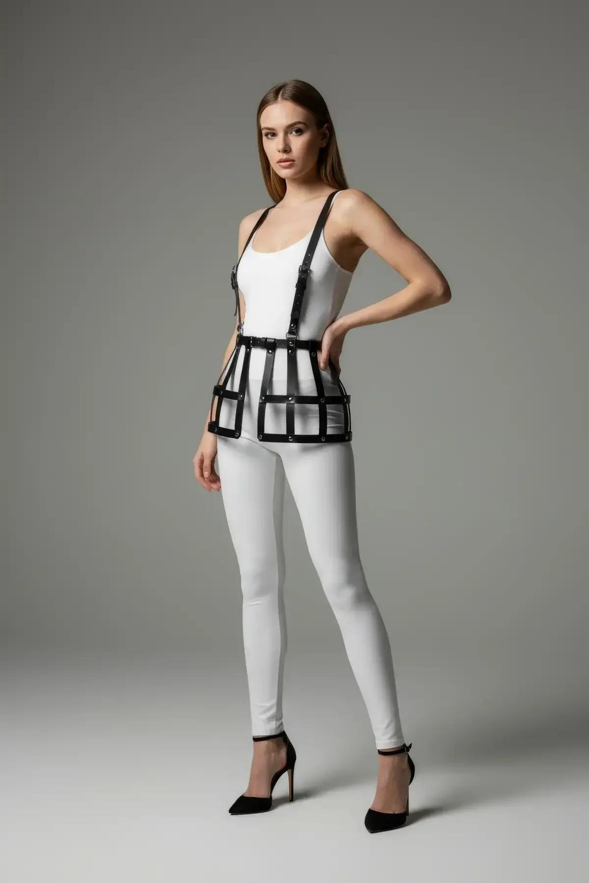 Front view of black PU leather cage harness showing rectangular bar frame at hip level with chrome rivet detail
