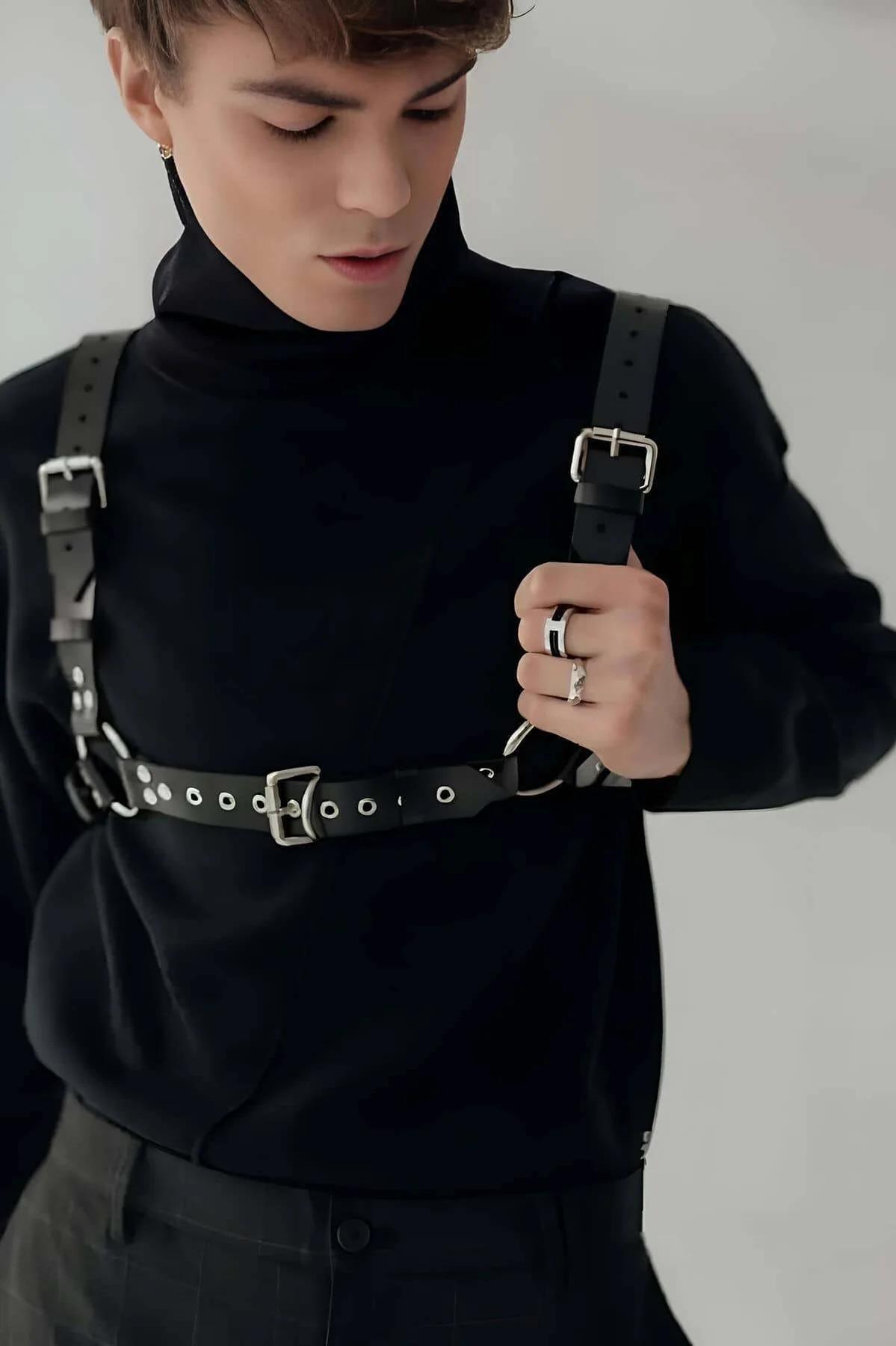 adjustable shoulder straps of black faux leather body harness showing buckle hardware