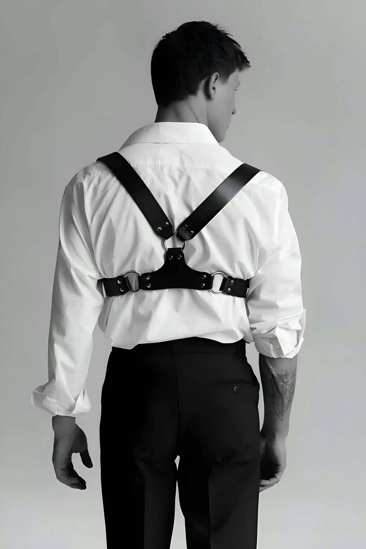 Front view black PU chest harness with double silver buckle band across lower chest