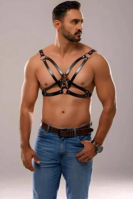Adjustable black faux leather chest harness showing front O-ring hardware detail and buckle adjusters