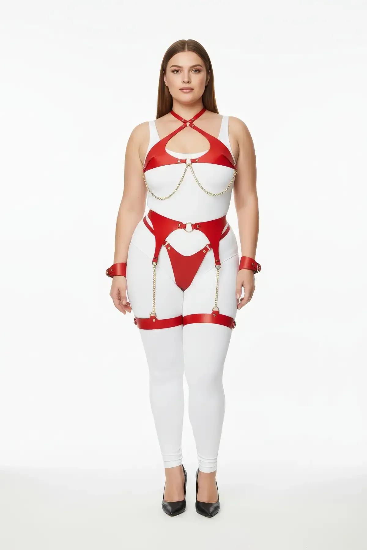 Red faux leather harness set with gold chains on plus-size model — chest harness, waist belt, garter straps, thigh bands and