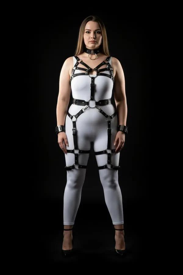 black vegan leather full body harness set with chest cage straps, O-ring waist belt, thigh and calf leg garters, silver buckl