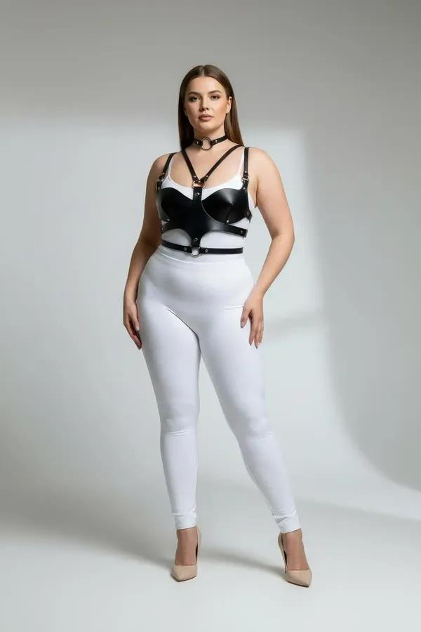 black faux leather chest harness with structured cups and matching O-ring choker set with gold-tone hardware