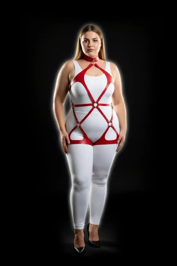 Red faux leather full body harness with gold O-ring details spanning neck to thigh on a plus-size model over white outfit