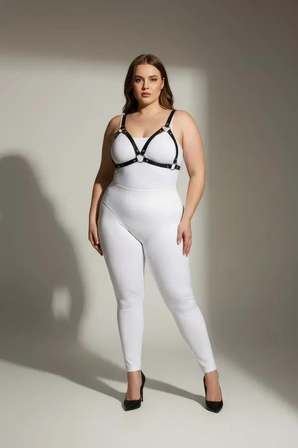black faux leather o-ring chest harness with slim 1 cm straps and silver center ring worn over white outfit